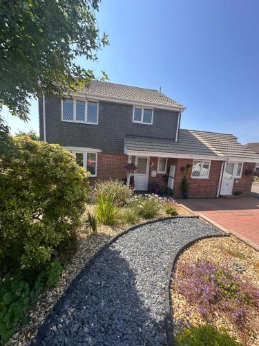 a house with a gravel driveway in front of it at The Haven 2 night minimum stay in Torpoint
