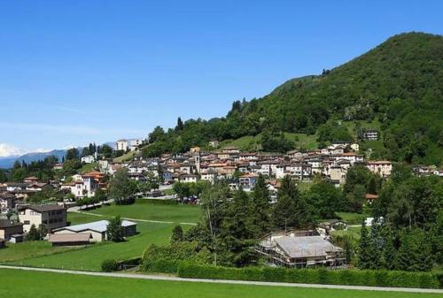 a town on top of a hill with houses at Casa Galett in Novaggio