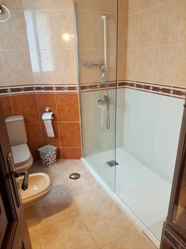 a bathroom with a shower and a toilet at Genial casa en centro in Ceuta