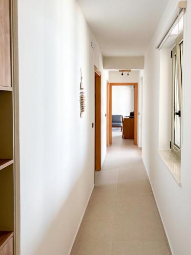 a hallway of a house with white walls at Maistros Villa in Rodakino