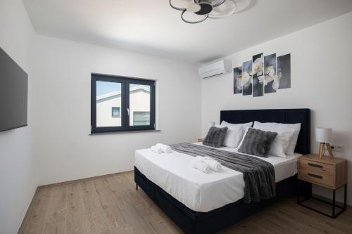 Cama ou camas em um quarto em Vila twins