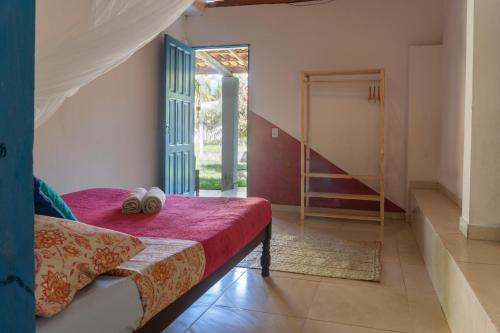 En eller flere senge i et værelse på Casamor Café e Hospedaria Praia de Algodões