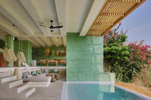 a living room with a pool in a house at Punta Nayaá - Adults Only in Puerto Escondido