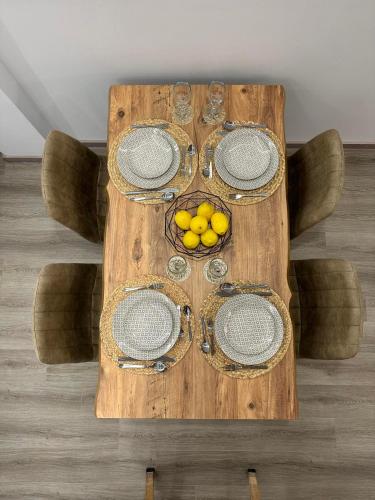 a wooden table with fruit on top of it at The Heidi's Central House in Kos Town