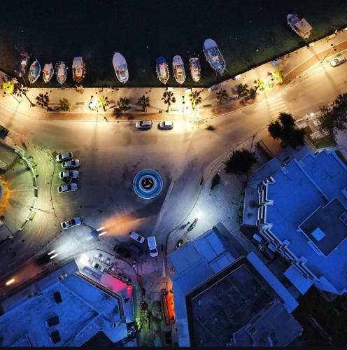 an overhead view of a parking lot at night at The Heidi's Central House in Kos Town