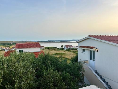 a view of the water from the balcony of a house at Apartman Ante Škoda Pivica in Povljana
