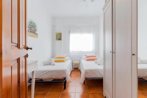 Postel nebo postele na pokoji v ubytování Preciosa casa a pie de playa Almardá