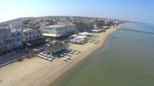 an aerial view of a beach with buildings and umbrellas at Siel Residences in Perea
