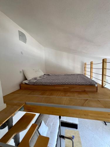 Postel nebo postele na pokoji v ubytování Tesla Apartman