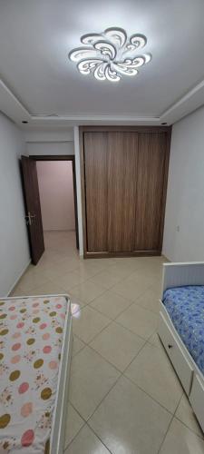 Una cama o camas en una habitación de Ryad el houda