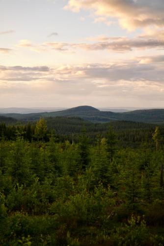 a view of the mountains from the top of a hill at Luxury off grid house in Viksjöfors