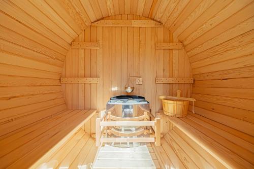 a inside of a wooden sauna with a stove at Private Glamping NAGOMI CAMP in Nasushiobara