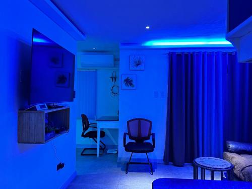 a living room with blue lights in a room at Olivia's Mi Casa in Lapu-Lapu, Cebu in Pusok