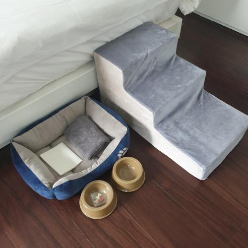 a bed with a dog bed and two bowls on the floor at Gout Stay in Daegu