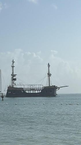 a large boat sitting in the middle of the ocean at Ocean Views & Private Beach! Luxury 4BDR Getaway in Punta Cana