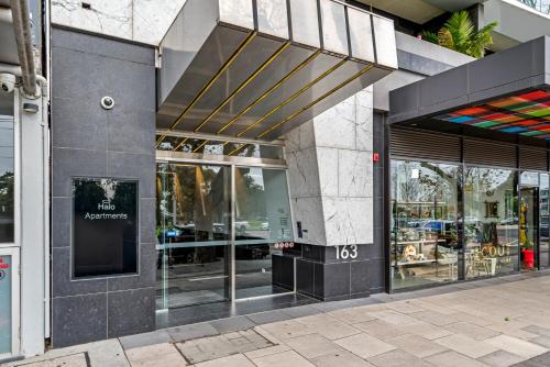 a store front of a building with glass doors at Complete Host Halo Apartments in Melbourne