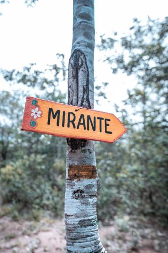 a sign on a tree that reads miridate at Chalé Guapuruvu- Refúgio Namata in Pirenópolis
