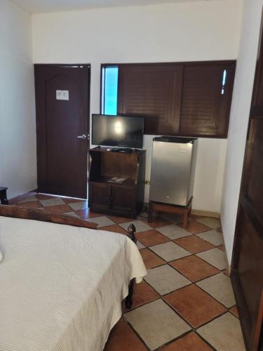 Postel nebo postele na pokoji v ubytování Hotel Valeria