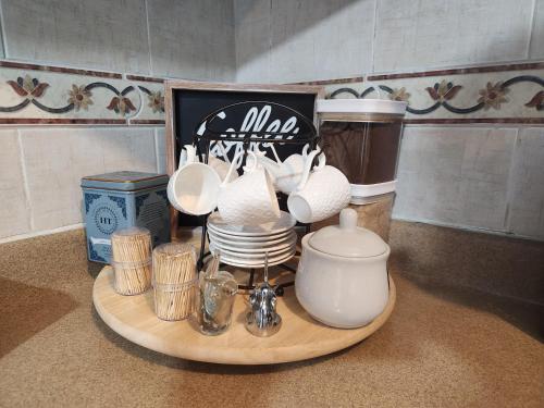a tray with dishes and other items on a counter at Private House with Pool, AC, BBQ, Fast Wi-Fi, Pet & Family Friendly, Near Colonial Zone, Mirador Sur Park & Ocean, in Santo Domingo in Santo Domingo