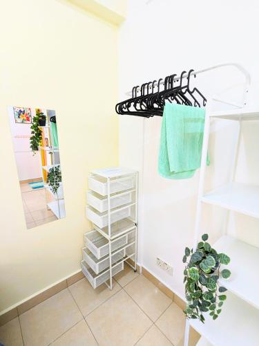 a room with white shelves and a rack at Private Room with Bathroom in Kuala Lumpur