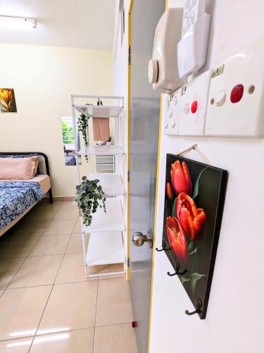 a room with a door with a painting of tulips at Private Room with Bathroom in Kuala Lumpur