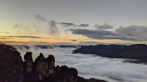 a view of the blue mountains with clouds at Flying Fox Backpackers in Katoomba