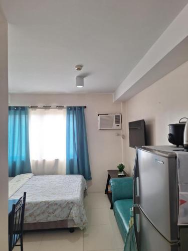 Ένα ή περισσότερα κρεβάτια σε δωμάτιο στο XIAN Condominium