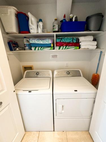 a small kitchen with two washes and towels at Modern Resort Condo - Pools, Courts & Scenic Views in St. George