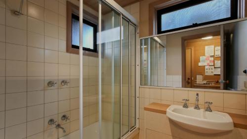 a bathroom with a sink and a shower at Pinnacle in Dinner Plain