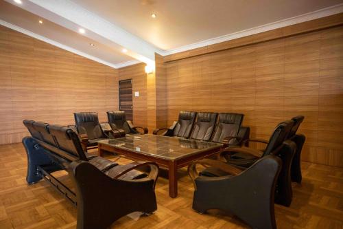 a conference room with a table and chairs at GP Hotels and Resorts in Nashik