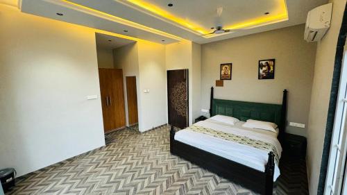 a bedroom with a large bed in a room at Hari Leela fort view palace in Chittaurgarh