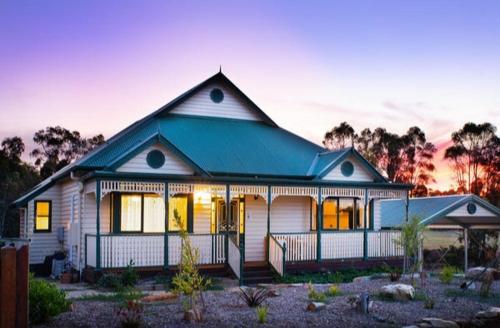 a white house with a green roof at Lilydale Lodge - Shared in Castlemaine