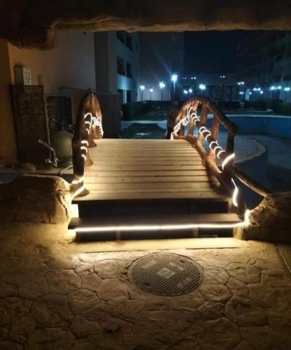 a set of stairs with lights at night at شاليه ديمورا عائلات فقط Dimora Chalet Only Family in Dawwār Muḩammad Abū Shunaynah