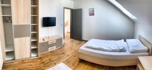 Postel nebo postele na pokoji v ubytování Apartmánové domy Lipno 1