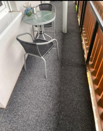 a table and chairs sitting on the floor of a building at Apartment Wohner in Petersaurach
