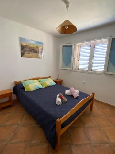 Postel nebo postele na pokoji v ubytování Villa pour 4 personnes proche Santa Giulia