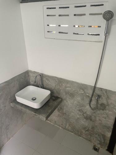 a bathroom with a sink and a shower at Sairee View Resort in Koh Tao