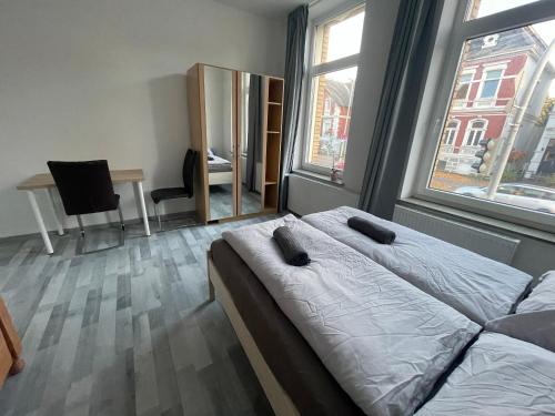 Postel nebo postele na pokoji v ubytování Schönes einfaches zentrales Zimmer in Oldenburg