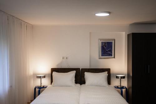 Postel nebo postele na pokoji v ubytování Brodnik Apartment