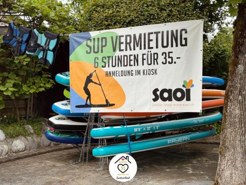 a sign for a surfering and summer fun sign at Family M Apartments 16-17-18 in Sempach