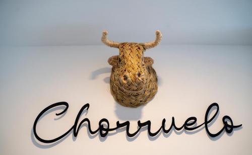 a sign that says chandon with a horned animal at La morada de Rosafina in Frigiliana