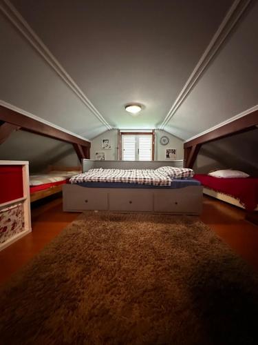 a bedroom with two bunk beds and a rug at House Laganini Grill & Relax in Sveti Križ