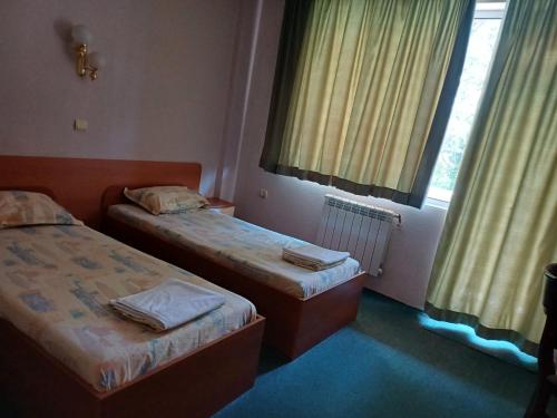 Postel nebo postele na pokoji v ubytování Интернационал