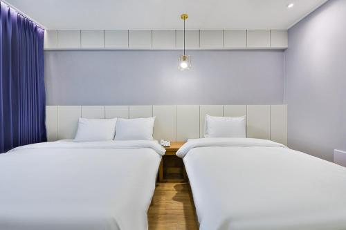 Ένα ή περισσότερα κρεβάτια σε δωμάτιο στο Hotel Langsam