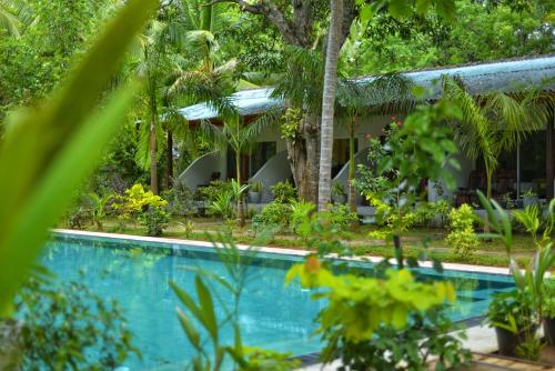 a view of a resort with a swimming pool at La Dolce Vita in Sigiriya