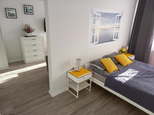 Postel nebo postele na pokoji v ubytování Dziwnówek Apartament