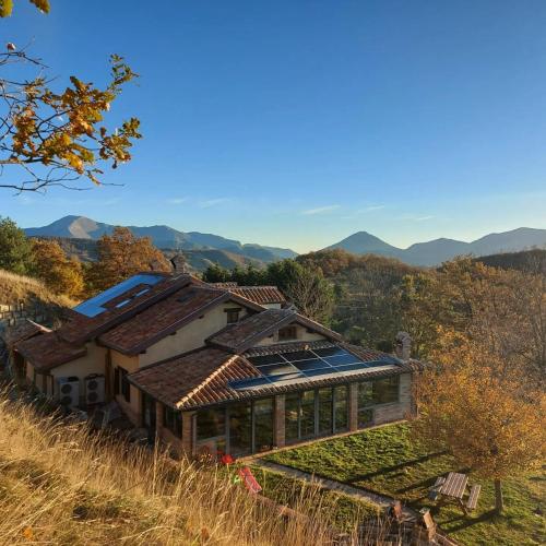 a house with solar panels on the roof at BnB Bagno di Bosco in Gubbio