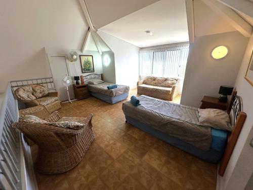 a living room with two couches and a couch at Osprey Holiday Village Unit 108 in Exmouth