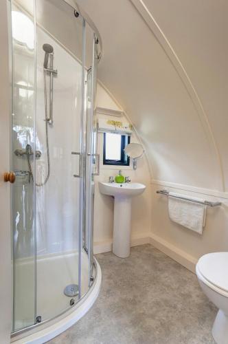 a bathroom with a shower and a sink at Finest Retreats - Wheatleys Glamping in Hexham