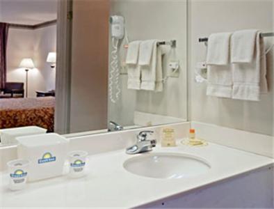 a bathroom with a sink and a mirror at Days Inn by Wyndham Bainbridge in Bainbridge